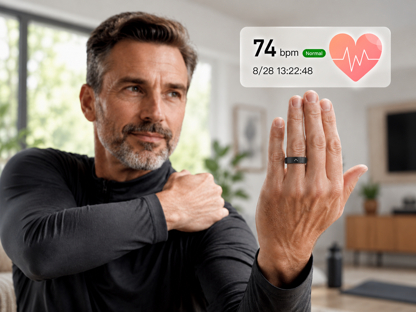 A person wearing a black smart ring on the index finger with a heart-rate reading of 74 bpm displayed alongside