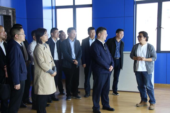 Group of customer visitors and staff during an on-site company tour