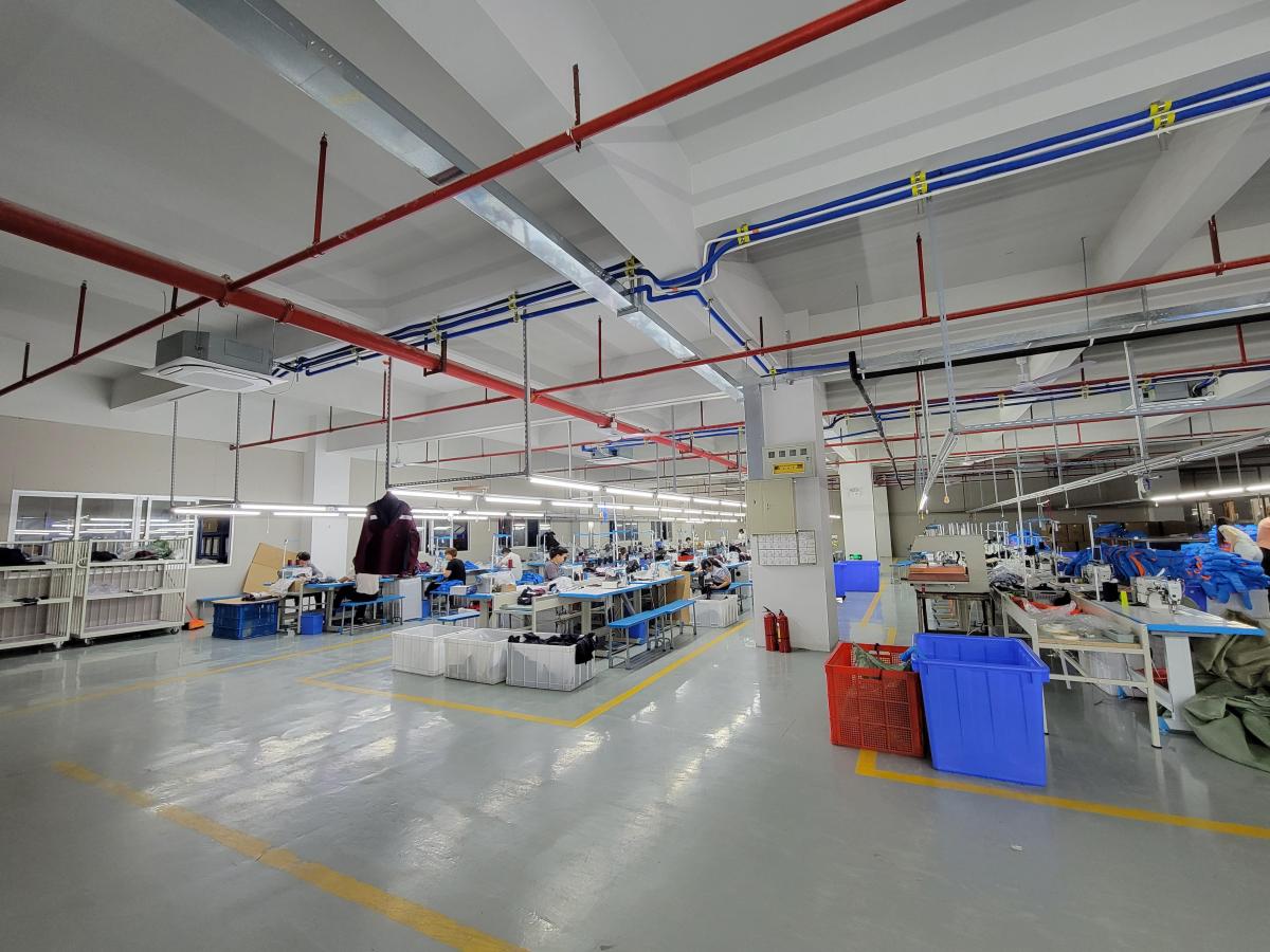 Open Pertemba workshop floor with worktables, equipment and marked lanes