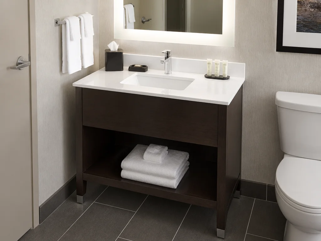 Compact single-basin vanity for standard hotel guest rooms