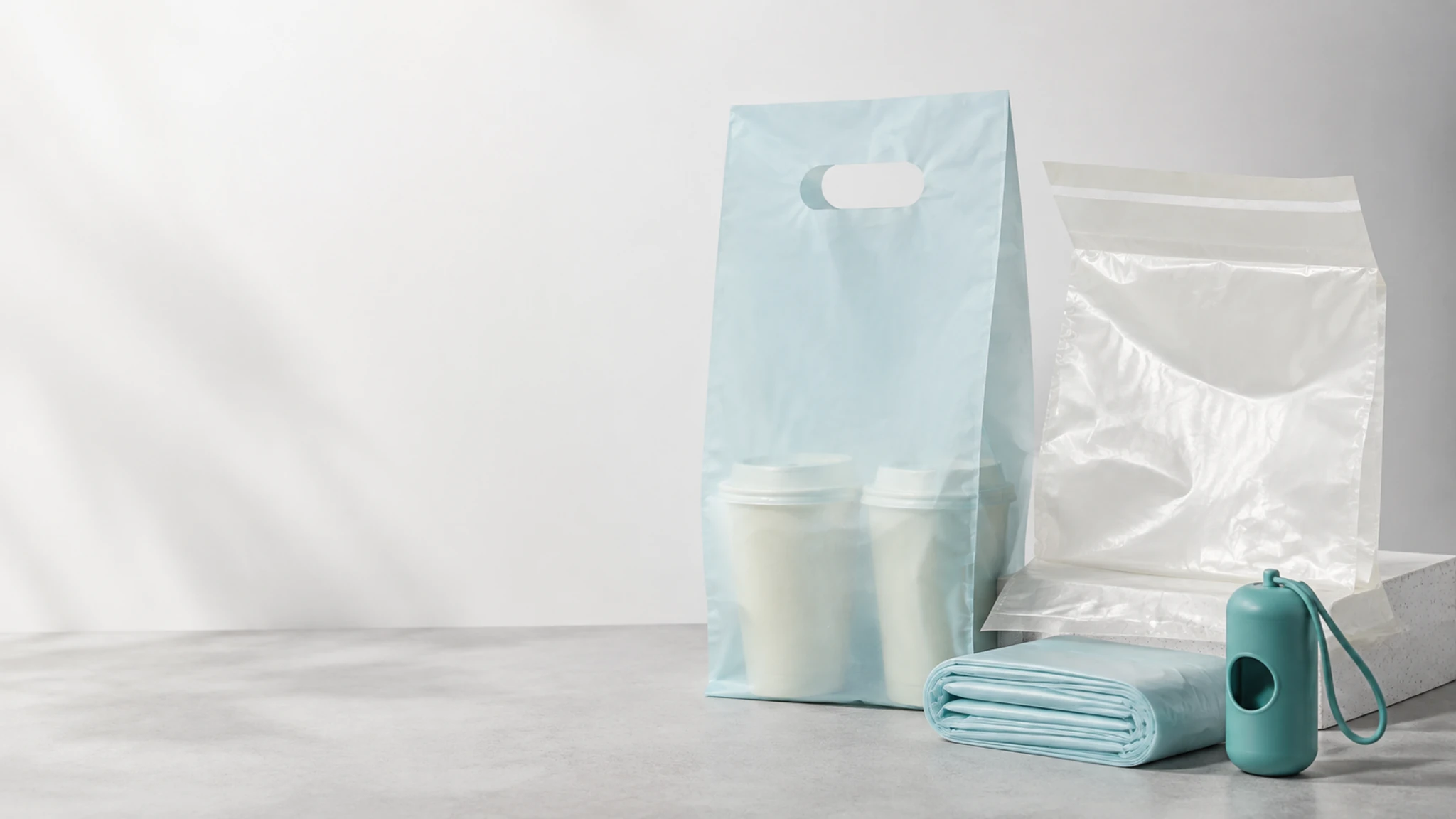 Takeout cup, self-adhesive and pet waste bag formats arranged for product comparison