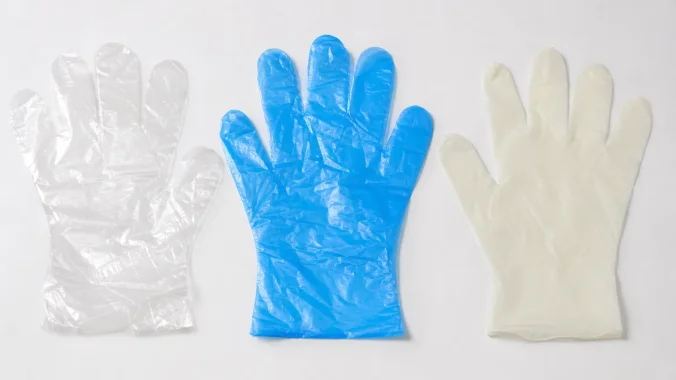 Three types of clean room disposable gloves — PE, CPE, and TPE — compared side by side on a sterile white surface