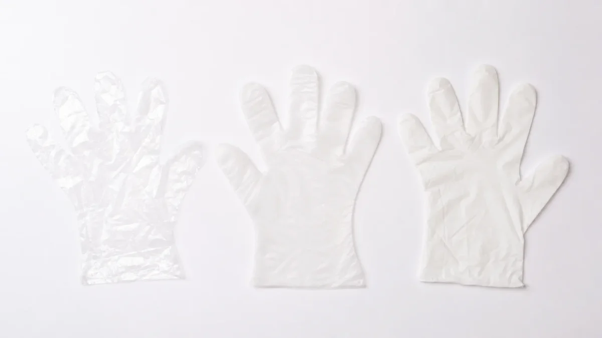 Three types of disposable food gloves compared side by side: thin clear HDPE, stretchy TPE, and thicker CPE for food handling