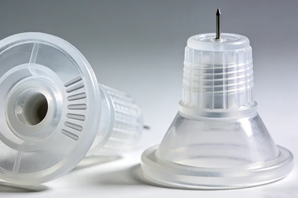 Customized silicone stoppers/seals for medical infusion sets