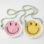 A round smiling face cross-body bag