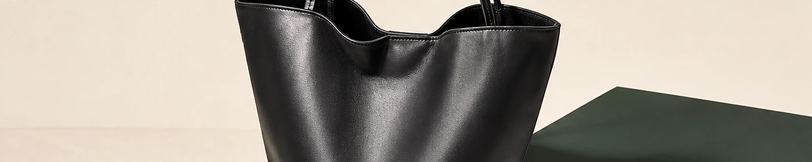 BLOOM-207 close-up showing bucket tote body handles and edge finish