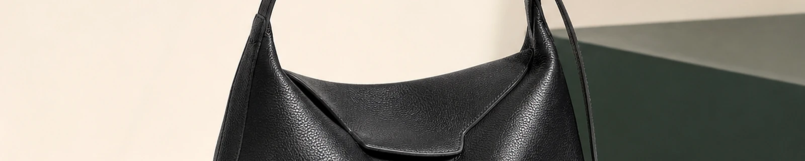 BLOOM-501 close-up showing black pebbled hobo drape and strap construction