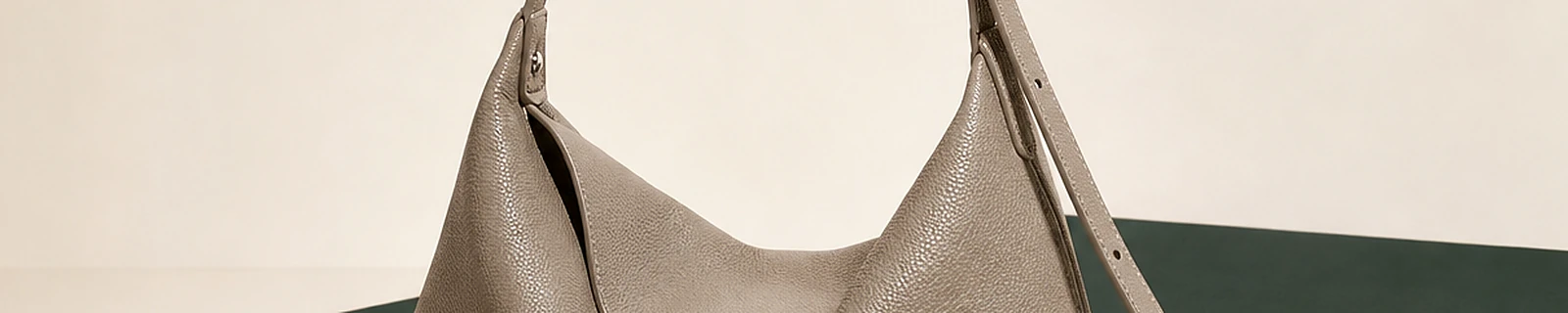 BLOOM-502 close-up showing taupe pebbled hobo drape and strap construction