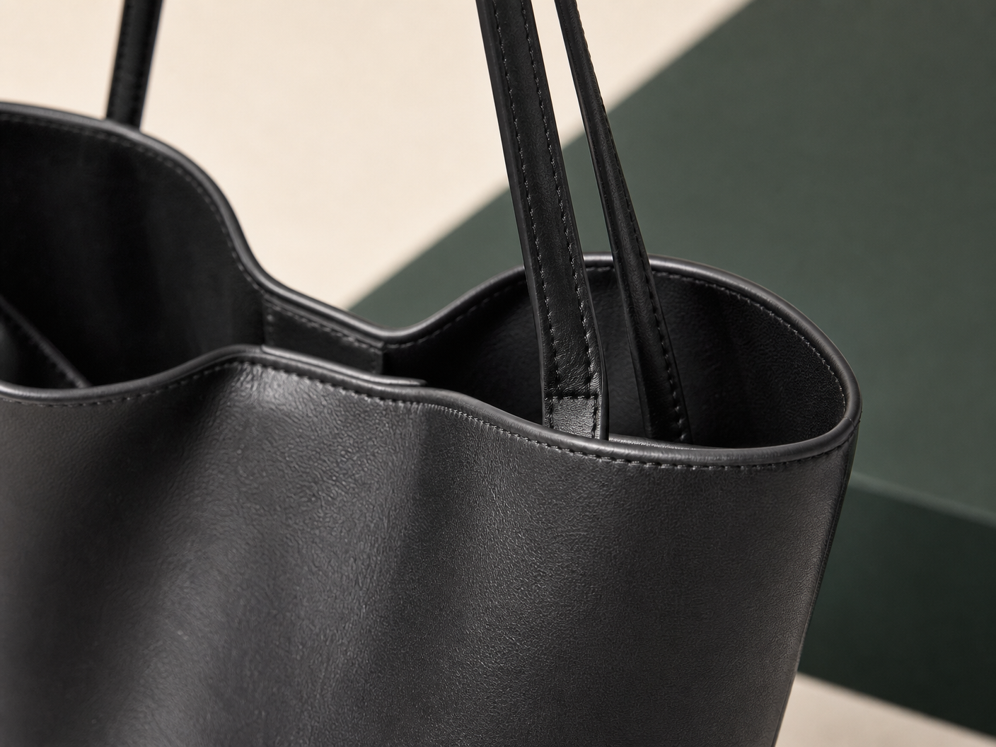 Close-up of BLOOM-207 Medium Bucket Tote material texture stitching edge paint and hardware