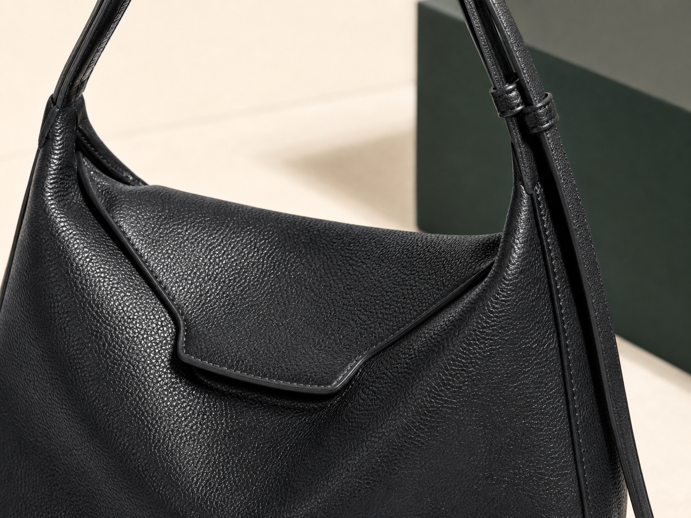 Close-up of BLOOM-501 Noir Soft Hobo material texture stitching edge paint and hardware