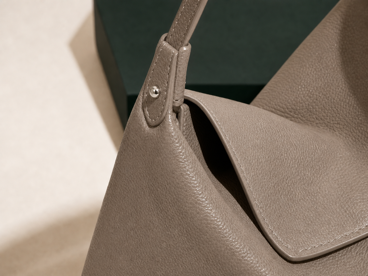 Close-up of BLOOM-502 Taupe Soft Hobo material texture stitching edge paint and hardware