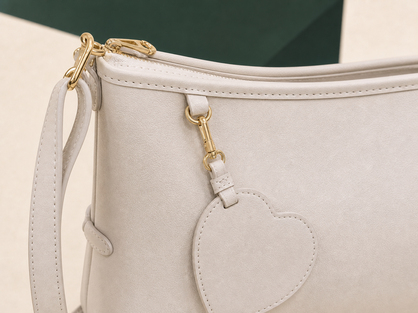 Close-up of BLOOM-504 Ivory Mini Hobo Set material texture stitching edge paint and hardware